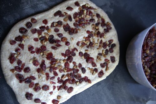 cranberries and pecans in bread dough