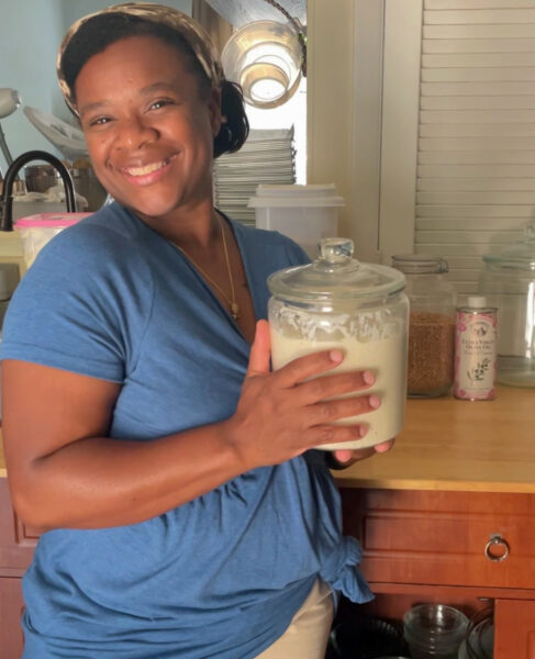Andrea Felder holding active and bubbly sourdough starter